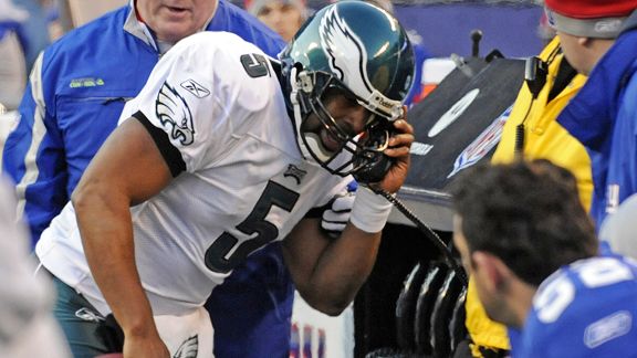 AP Photo/Bill Kostroun - Donovan McNabb dialed in the Giants' press box after a visit to the N.Y. sideline. 