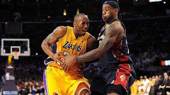 Western All-Star Kobe Bryant (24), of the Los Angeles Lakers, knocks the  ball away from Eastern All-Star LeBron James (23), of the Cleveland  Cavaliers, during the first half of the NBA All-Star