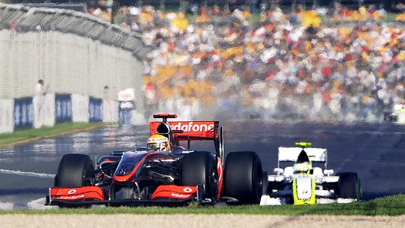 Lewis Hamilton of Britain leads Brawn GP Formula One driver Rubens Barrichello