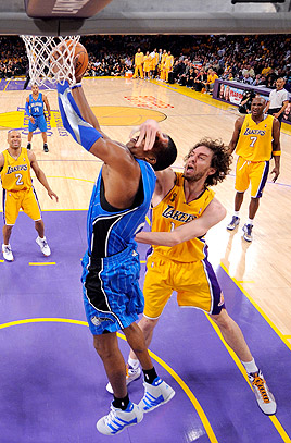 Orlando Magic's Hedo Turkoglu drives past the Los Angeles Lakers Pau Gasol  for a layup in the first quarter during Game 1 of the NBA Finals at the  Staples Center in Los