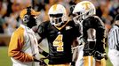 Frank Wilson with Gerald Jones (4) and Denarius Moore (6)