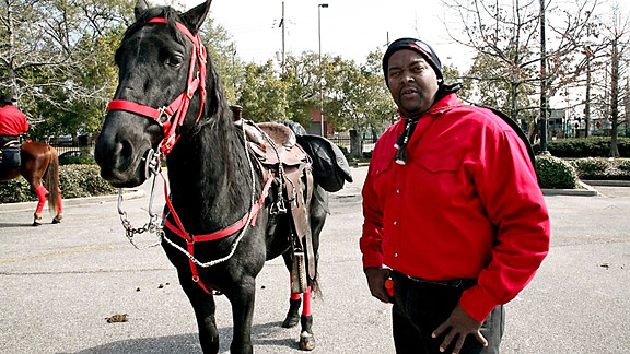 Man with horse in red... Super Bowl Sunday 2010 New Orleans, LA