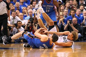 The Mavs' Dirk Nowitzki loses the ball to the Thunder's Nick Collison 