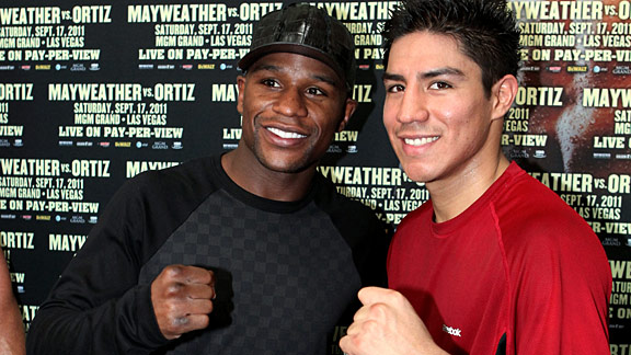 Floyd Mayweather poses with boxer Jessie Vargas