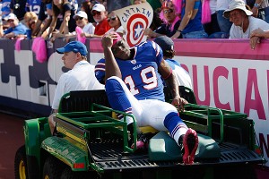 AP Photo/David Duprey Buffalo receiver Donald Jones is carted off the 