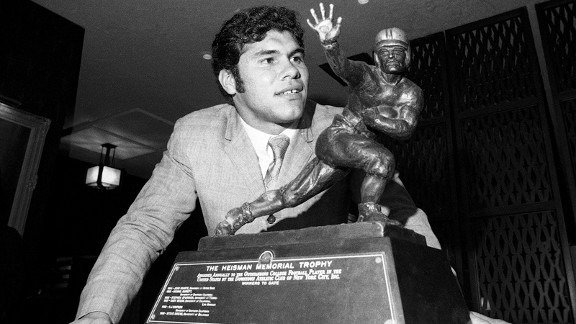 Jim Plunkett, Stanford University quarterback, looks at the Heisman Trophy he won Nov. 24, 1970 in New York. Plunkett won the trophy as college football’s outstanding player of 1970.