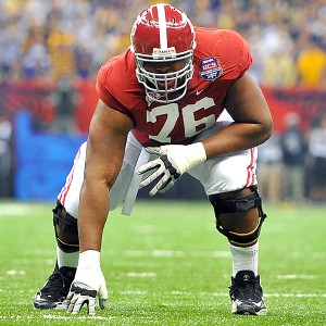 alabama game lineman jumping line and blocking point