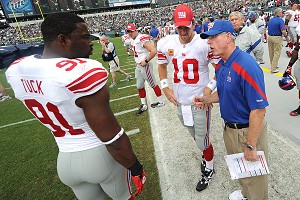 Justin Tuck, Eli Manning and Tom Coughlin