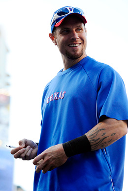 The Texas Rangers' Josh Hamilton, left, pauses to talk with