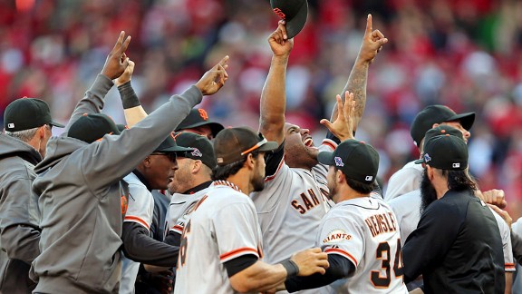 Pablo Sandoval and the Giants celebrating their win over the Cincinnati Reds