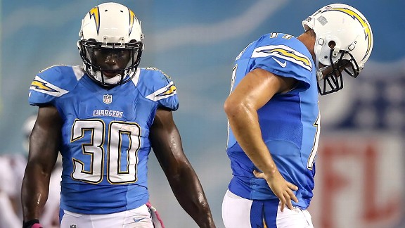 Ronnie Brown and Philip Rivers after the San Diego Chargers lost to the Denver Broncos