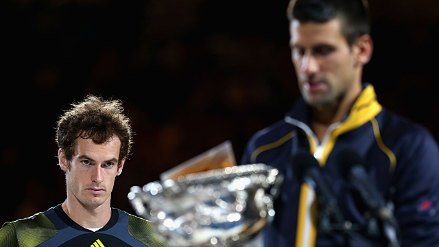 Andy Murray of Great Britain (L) watches Novak Djokovic of Serbia