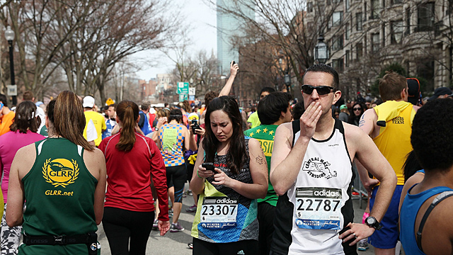 Runners react near Kenmore Square