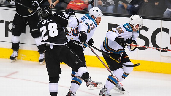 Raffi Torres of the San Jose Sharks hitting Jarret Stoll of the Los Angeles Kings