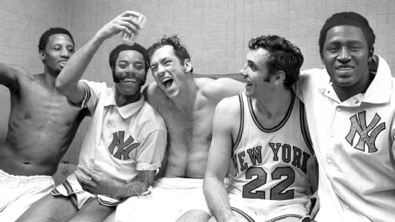 The New York Knicks' starting five -- Dick Barnett, Walt Frasier, Bill Bradley, Dave DeBusschere, and Willis Reed (l. to r.) -- rejoice in the dressing room after winning their fifth playoff game against the Milwaukee Bucks, by a lopsided score of 132-96,
