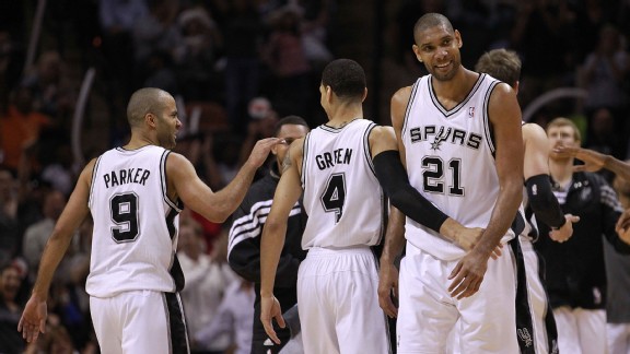 Tony Parker #9, Daniel Green #4 and Tim Duncan #21 of the San Antonio Spurs celebrate during play against the Los Angeles Clippers in Game Two of the Western Conference Semifinals of the 2012 NBA Playoffs at AT&T Center on May 17, 2012 in San Antonio, Tex