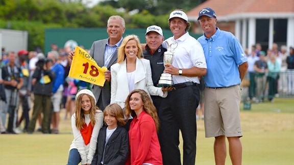 Phil Mickelson and his team: back row: manager Steve Loy, wife Amy, coach Butch Harmon, Mickelson, caddy Jim Mackay. Front row: Sophia, Evan and Amanda