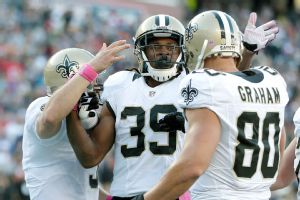 Drew Brees, Travaris Cadet and Jimmy Graham