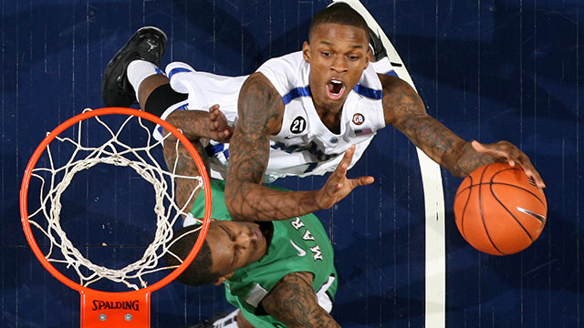 Joe Jackson #1 of the Memphis Tigers shoots a layup against Damler Pitts #3 of the Marshall Thundering Herd on January 28, 2012 at FedExForum in Memphis, Tennessee. Memphis beat Marshall 83-76.