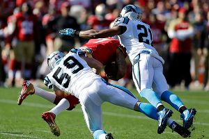Luke Kuechly and Mike Mitchell tackle Colin Kaepernick