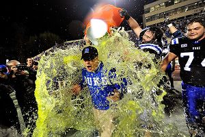 Duke and David Cutcliffe celebrate after beating Miami