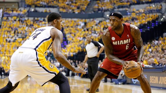 LeBron James (6) drives the ball against Indiana Pacers forward Paul George