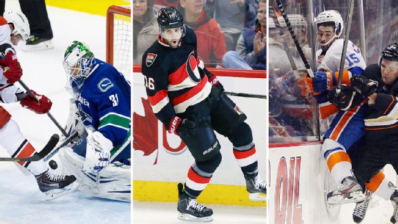 Eddie Lack, Clarke MacArthur, and Islanders