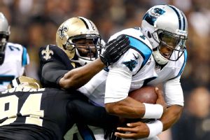 Cameron Jordan, Junior Galette, and Cam Newton