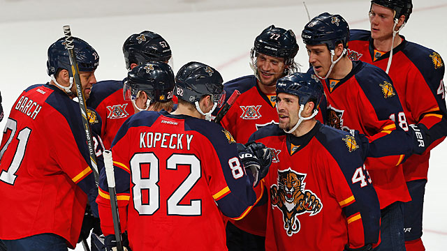 Mike Weaver #43 congratulates Tomas Kopecky #82 of the Florida Panthers