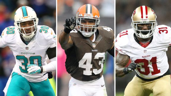 Chris Clemons, T.J. Ward, and Donte Whitner