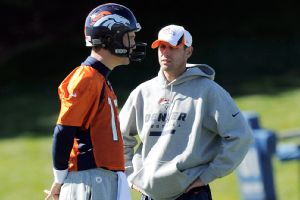 Payton Manning and Adam Gase