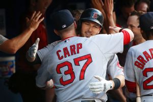 TORONTO, CANADA - JULY 21: Stephen Drew #23 of the Boston Red Sox is congratulated by Mike Carp #37 after hitting a three-run home run in the third inning during MLB game action against the Toronto Blue Jays on July 21, 2014 at Rogers Centre in Toronto, O