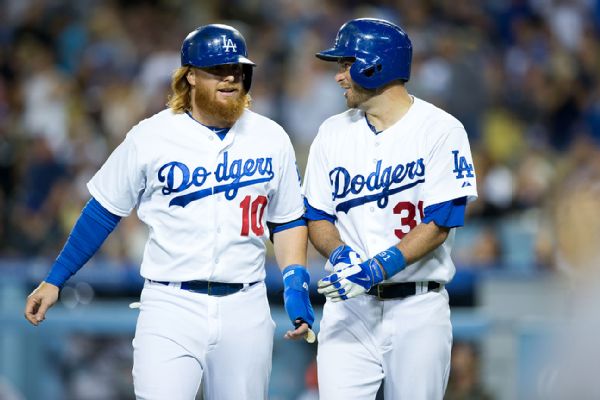 Cal Sport Media/AP Images "I just put my work in the cage and prepare," said Justin Turner, left, with catcher Drew Butera at Dodger Stadium on Friday.