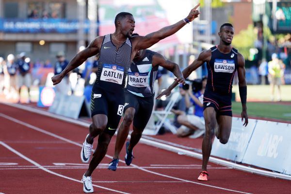 Justin Gatlin finishes the men's 100-meter finals ahead of Trayvon Bromell, not pictured, and Marvin Bracy, center, at the U.S. Olympic track and field trials.