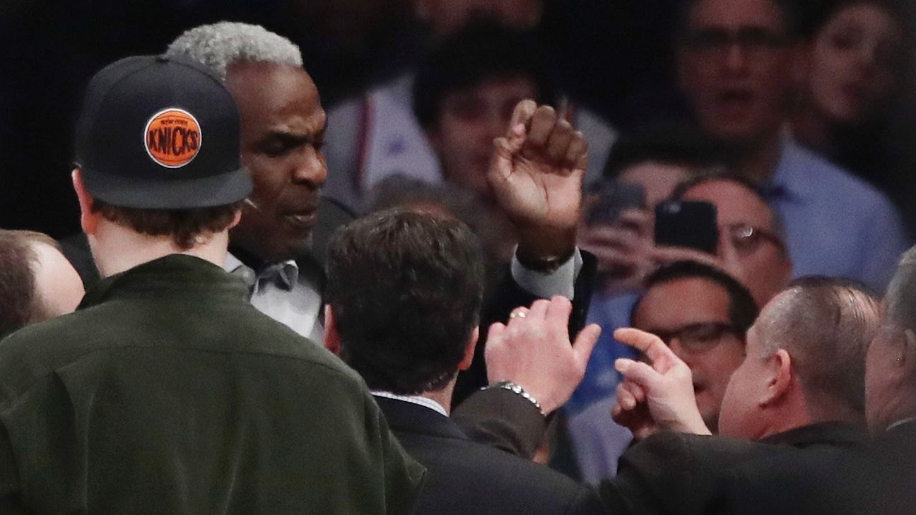 Charles Oakley with security at Madison Square Garden