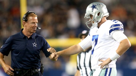 Dallas Cowboys head coach Jason Garrett (left) fist bumps quarterback Cooper Rush (7)