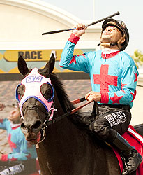 Mike Smith celebrates aboard Joker Face after their match race victory.