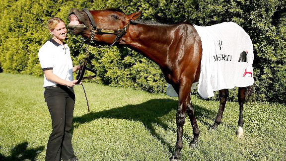 Jennifer Patterson walks Kentucky Derby winner Orb at Pimlico.
