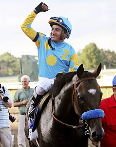 Jockey Rafael Bejarano celebrates after Paynter's Haskell victory.
