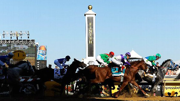 The field takes the first turn at Pimlico for the 137th Preakness Stakes.