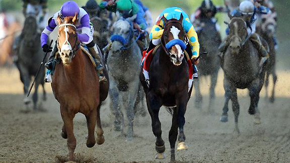 I'll Have Another (left) runs down Bodemeister to win the 137th Preakness Stakes.