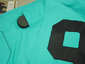 The Trakus tags fit inside the saddle cloth.