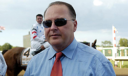 Trainer Rick Dutrow stands in front of Big Brown after winning the Haskell Invitational at Monmouth Park.