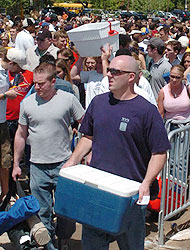 Preakness fans enter Pimlico for the party.