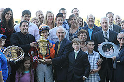 Repole (far left) celebrates in the Belmont Park winner's circle.