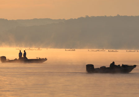 Through the fog, spectator boats can be seen waiting patiently for the tournament day to begin.