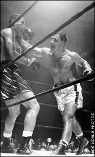 Rocky Marciano lands a right to the face of Joe Louis during their Oct ...