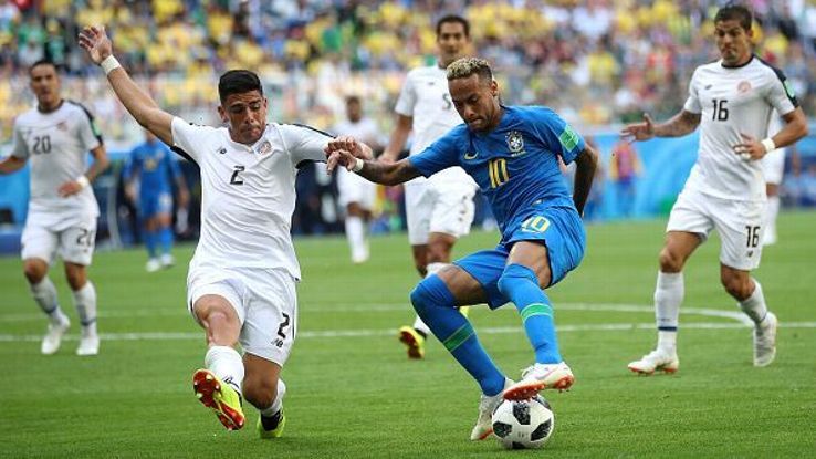 Johnny Acosta tries to stop Neymar during the 2018 FIFA World Cup Russia group E match between Brazil and Costa Rica