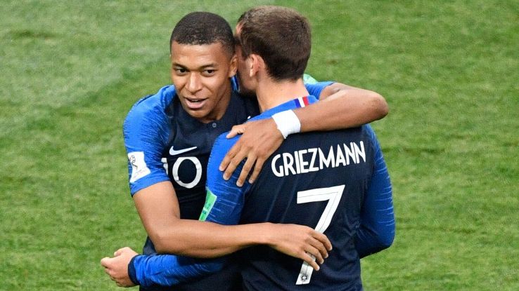 Kylian Mbappe celebrates a goal with France's teammate Antoine Griezmann 