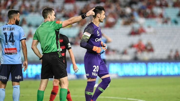 Referee Jarred Gillett instructs Vedran Janjetovic of Western Sydney Wanderers to leave the field